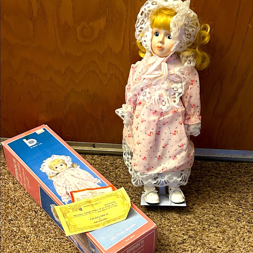 Brinn’s 1988 collectible with the box, certificate , and stand